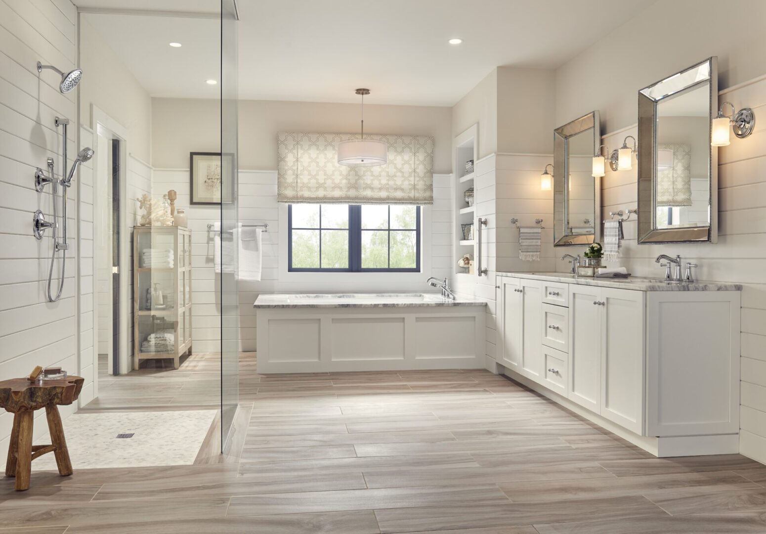 A White Themed Bathroom With Tub and Shower